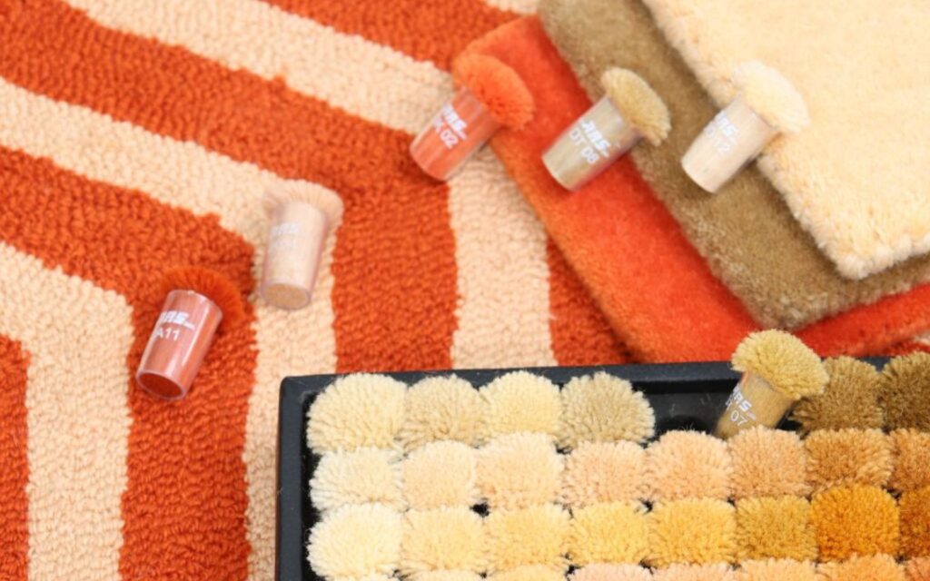 Monochrome rugs styled in a tone-on-tone interior, featuring layered textures in neutral shades like ivory, charcoal, and taupe to create subtle depth and quiet luxury.